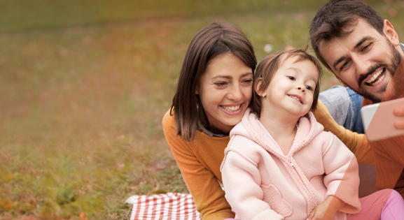 Family outside taking a selfie with Orange CHPA overlay